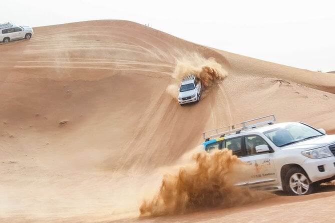 Desert Safari Experience With Dune Bashing and Dinner in Dubai - Exhilarating Dune-Bashing Tour