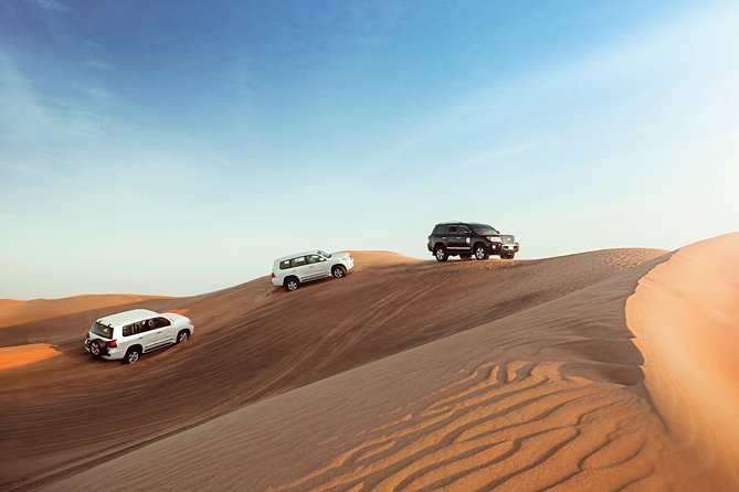 Desert Safari Dubai With Dune Bashing, Sandboarding, Camel Ride, 5 Shows, Dinner - Thrilling Dune Bashing Adventure