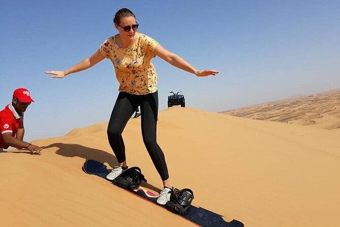 Dubai Self-drive Quad Bike, Sand Boarding, Camels & Refreshments - Exhilarating Sandboarding Experience