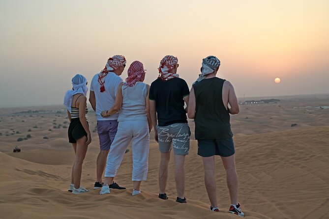 Evening Desert Safari in Dubai, Sandboard & BBQ Dinner - Camel Ride and Henna Painting