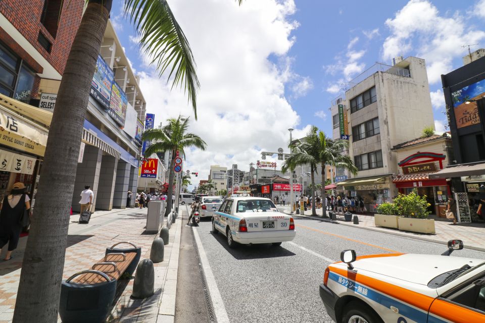 Exploring Okinawas Natural Beauty and Rich History - Bustling Area With Shops, Restaurants, and Street Performers
