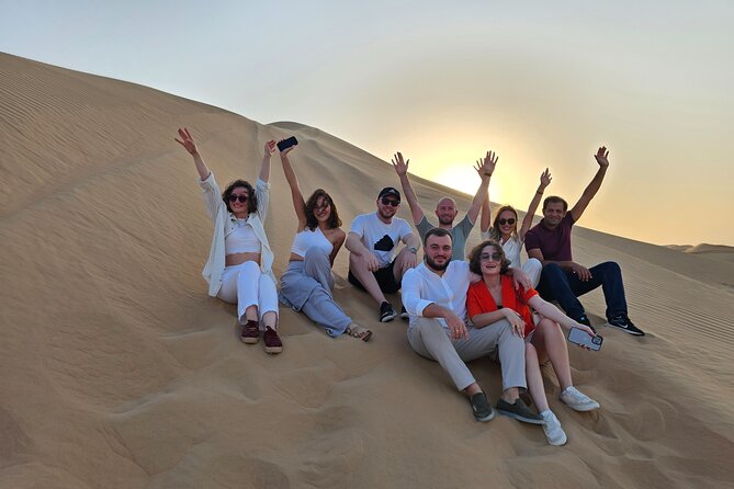 Abu Dhabi Desert Safari With Live Shows And BBQ Buffet Dinner - Camel Ride and Sunset Photo