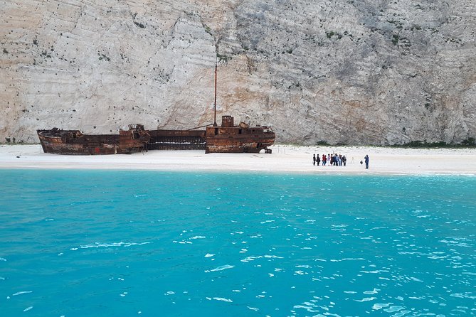 Zakynthos : One Day Small Group Tour to Navagio Beach Blue Caves & Top View - Blue Caves Boat Tour
