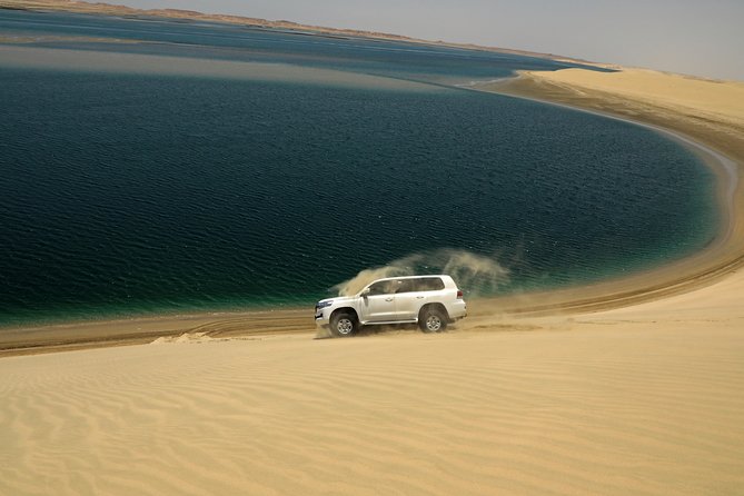 Desert Safari With Camel Ride, Sand Boarding & Inland Sea Tour in Doha - Key Points