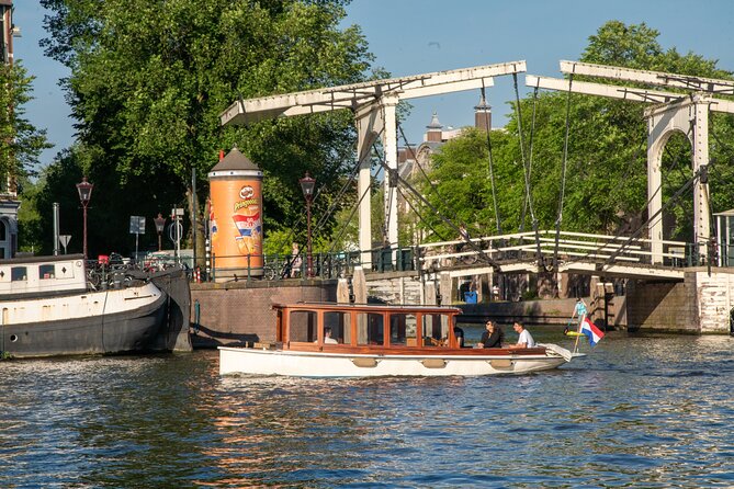Private Boat Tour Amsterdam - 90 Min Incl. Welcome Drink on Historic Saloon Boat - Tour Overview