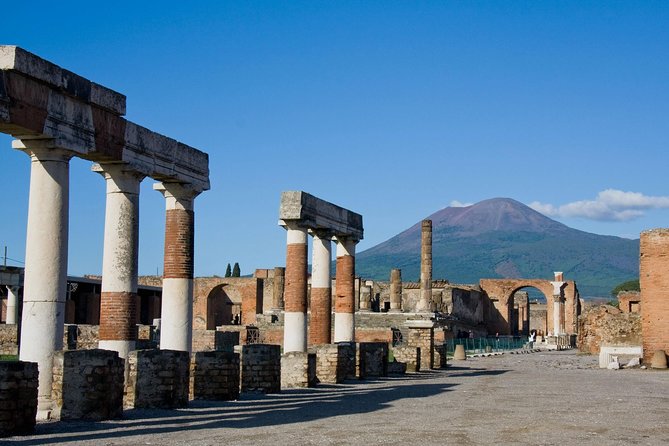 Guided Day Tour of Pompeii and Herculaneum With Light Lunch - Explore Herculaneums Ruins