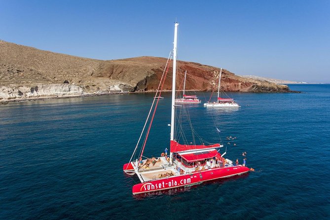 Sailing Catamaran Cruise in Santorini With Bbq, Drinks and Transfer - Unlimited Drinks and Beverages