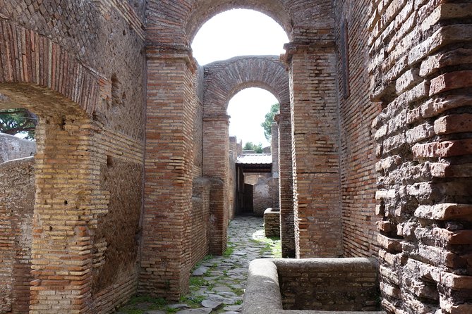 Ancient Ostia Antica Semi-Private Day Trip From Rome by Train With Guide - Exploring the Ancient Port City
