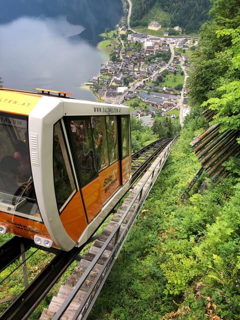 From Vienna: Day Tour to Hallstatt and Salzburg & Boat Ride - Itinerary and Transportation