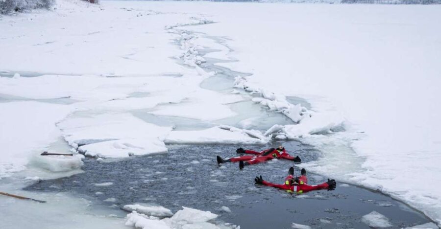 Tromsø: Arctic Ocean Floating Camp Rescue Suit Swimming