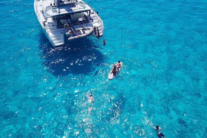 Discover Cala Bassa and Cala Comte on Board a Catamaran