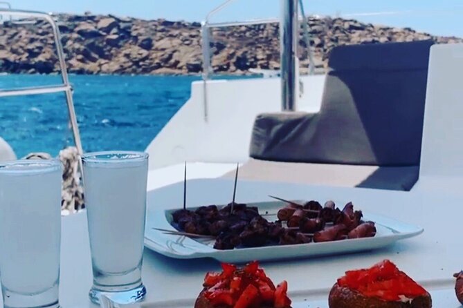 Full Day Discovering Mykonos Delos Renia Tour by Boat