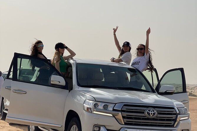 Dubai Red Dune Desert Safari Camel Ride Sandboard & BBQ Dinner