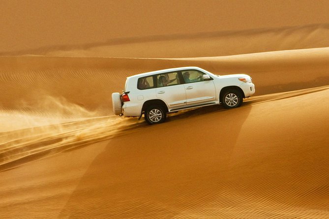 Evening Desert Safari Dubai With Buffet, Dune Bashing, Camel Riding, and Tanura