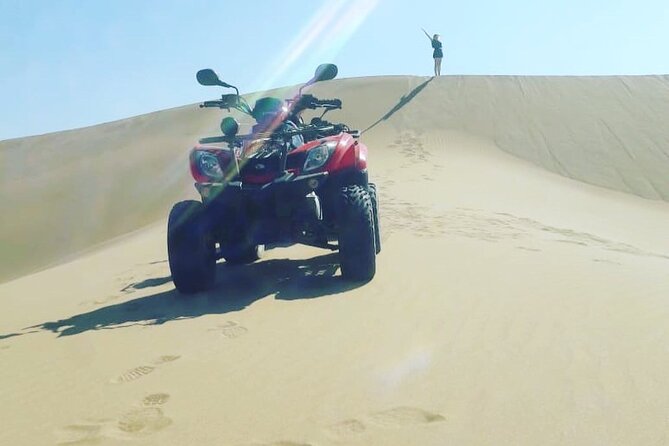 Quad Biking and Sandboarding on Sand Dunes Wild Beach - Quad Biking on Coastal Trails
