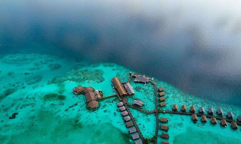 Semporna: Mabul and Kapalai Trip in Snorkel or Dive & Lunch - Stop 1: Mabul Water Bungalows and Water Village